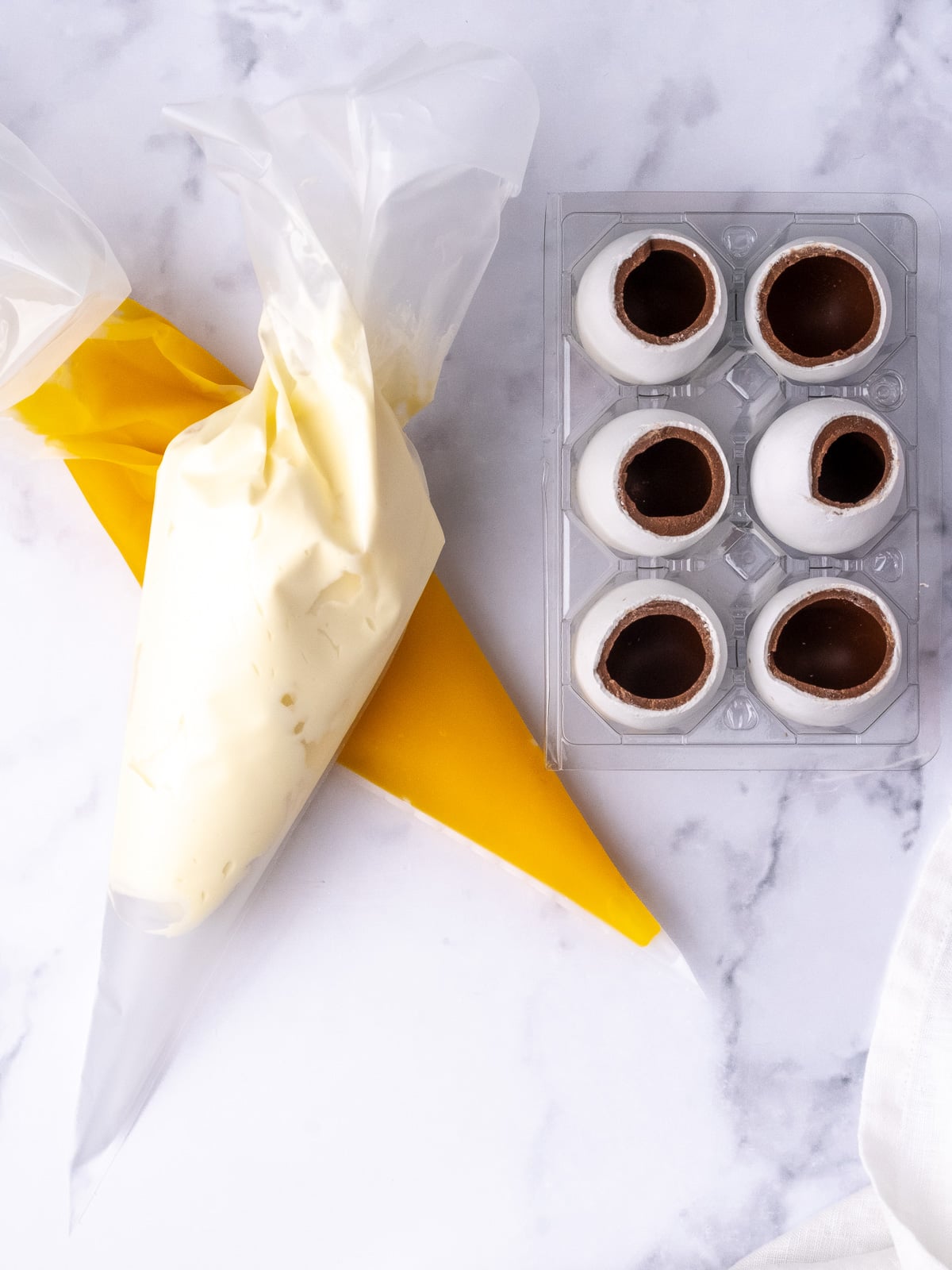 Image shows step 5 of how to make cheesecake Easter eggs.