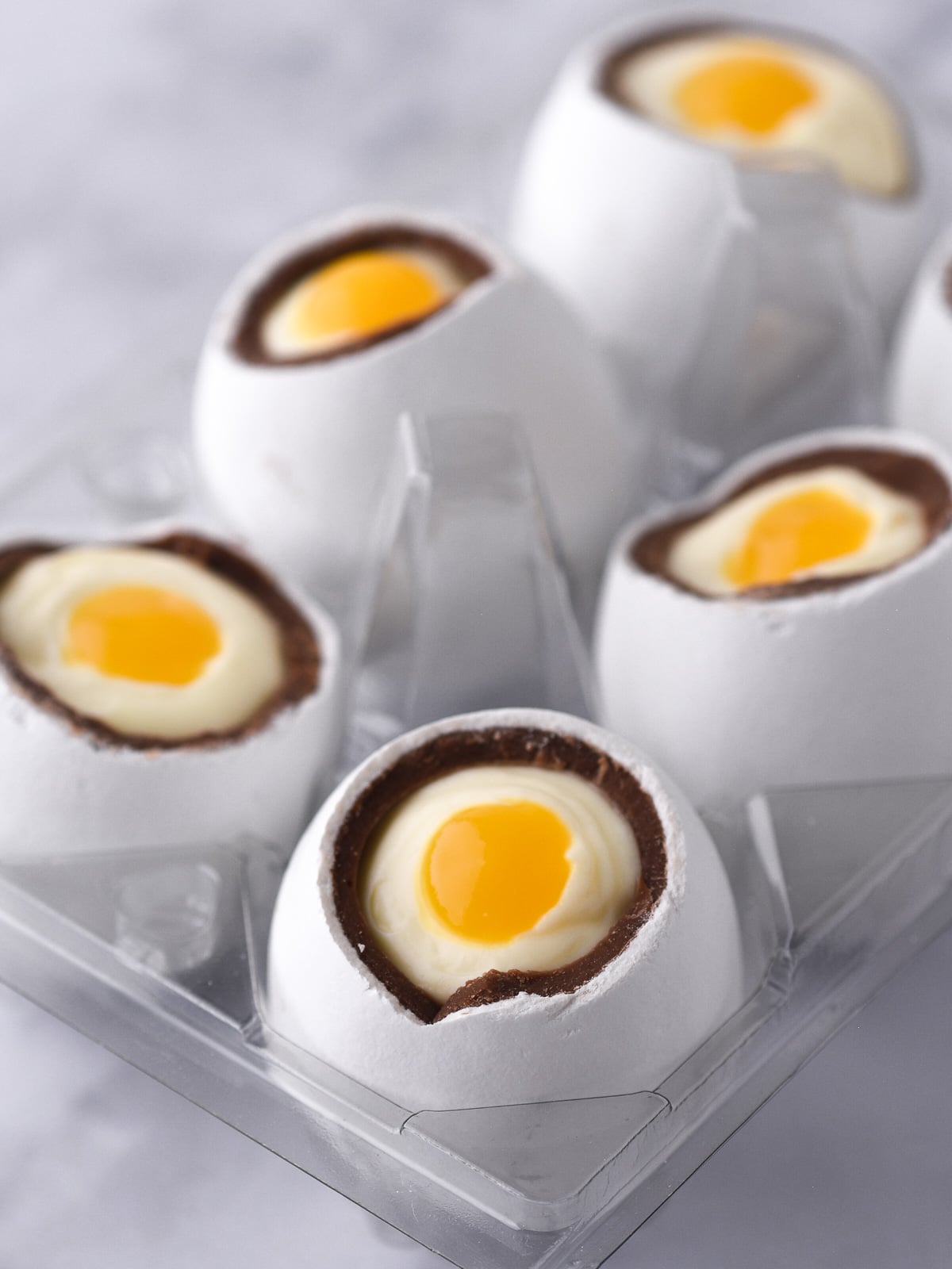 Image shows step 6 of how to make cheesecake Easter eggs.