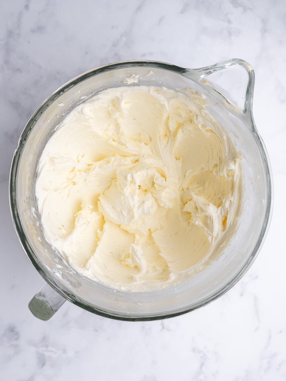 Image shows step 2 of how to make a vanilla buttercream frosting.