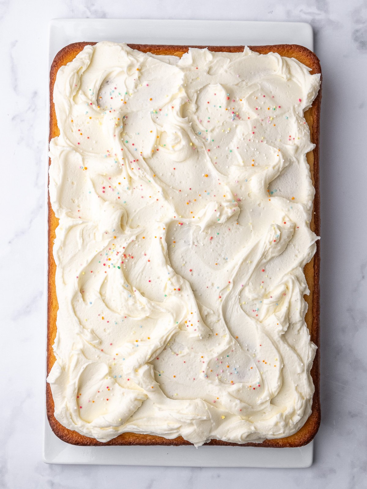 Image shows step 4 of how to make a vanilla buttercream frosting.