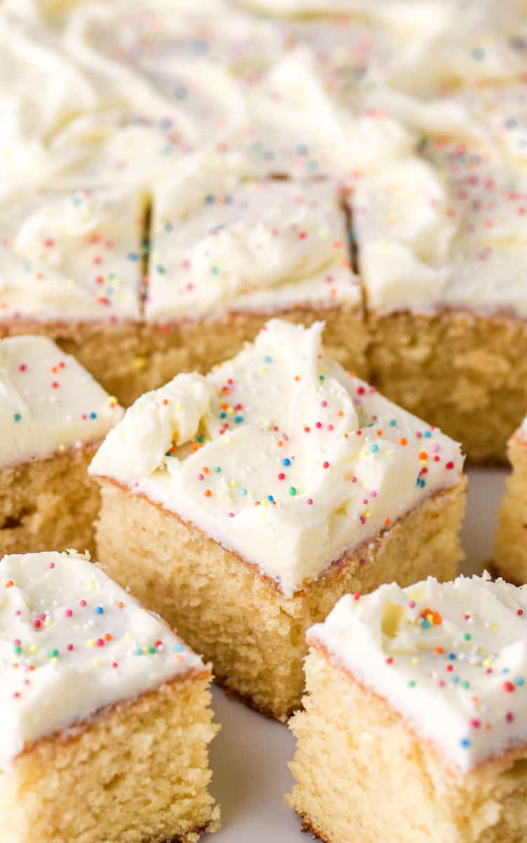 Vanilla Tray Bake slices shown on a white plate.
