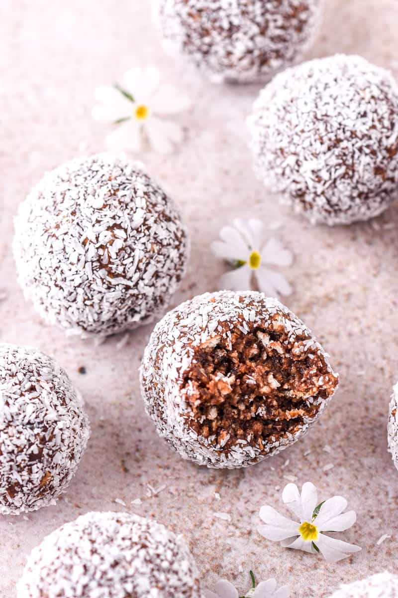 Truffles shown on a kitchen counter, one truffle is bitten in half.