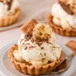 Mini Banoffee Tartlets shown on a kitchen counter