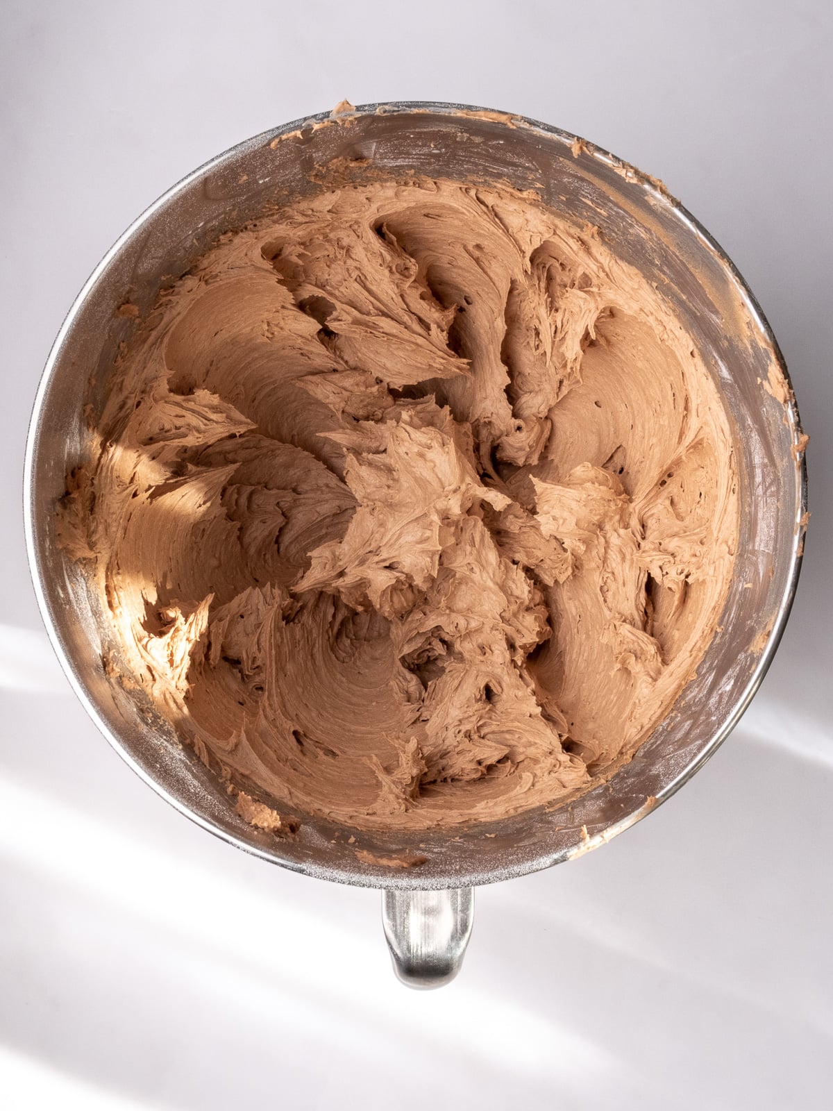 Image shows step 3 of how to make Nutella buttercream.