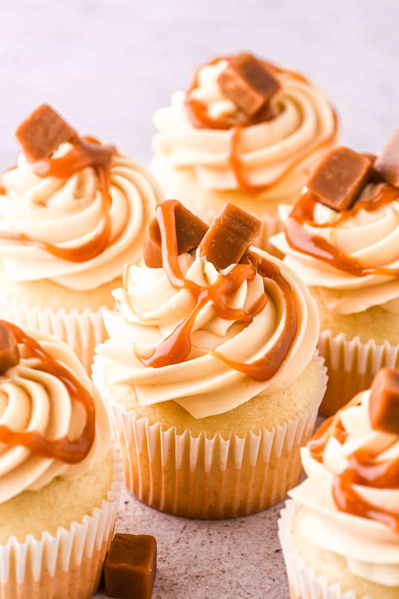 Caramel Filled Cupcakes shown on a group on a kitchen counter.