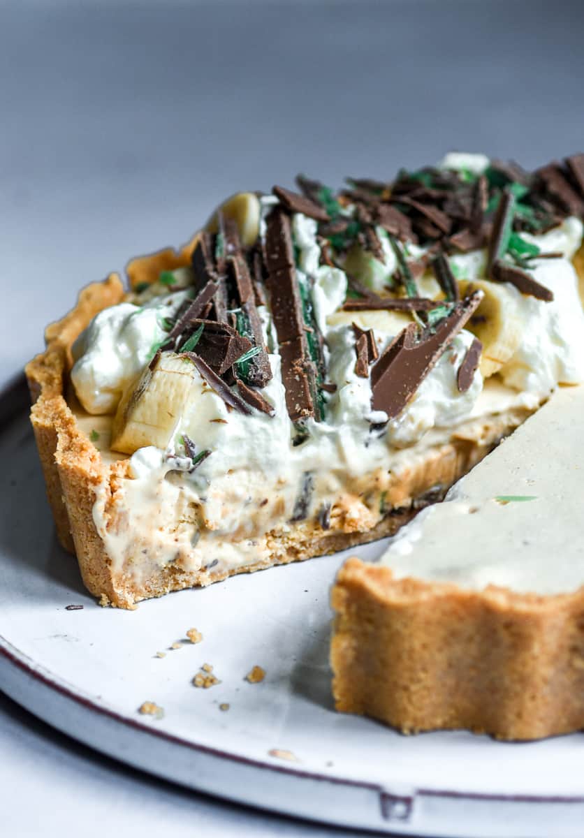 Peppermint crisp tart shown from the side, you can see a slice missing.