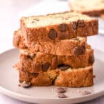 Chocolate Chip Loaf Cake slices shown stacked on a plate