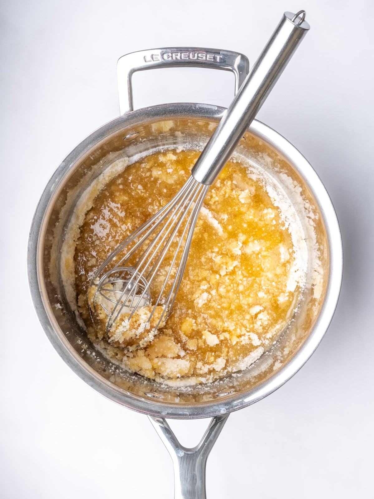 Image shows step 2 of how to make the salted caramel sauce for apple crumble tarts.
