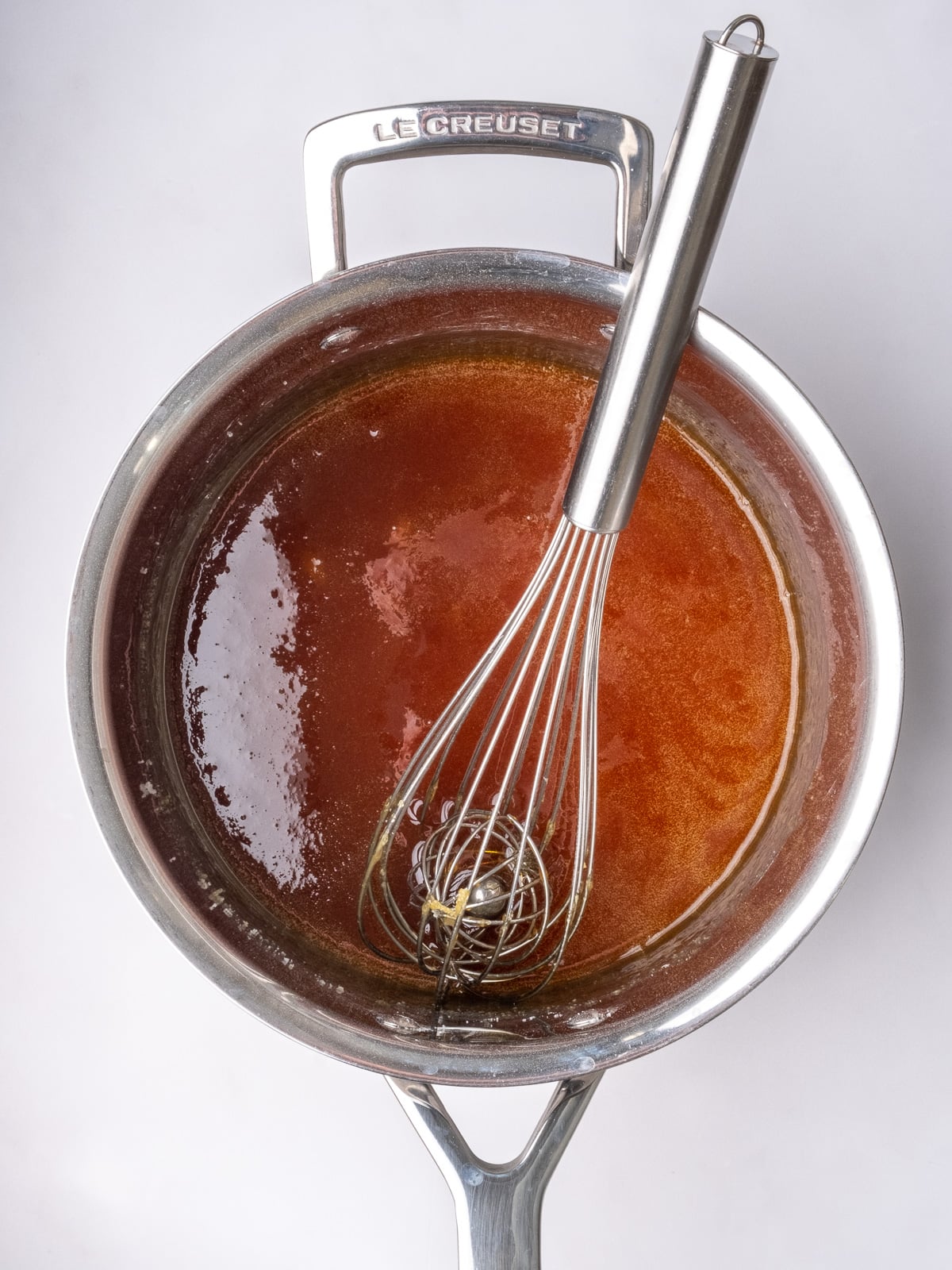 Image shows step 3 of how to make the salted caramel sauce for apple crumble tarts.