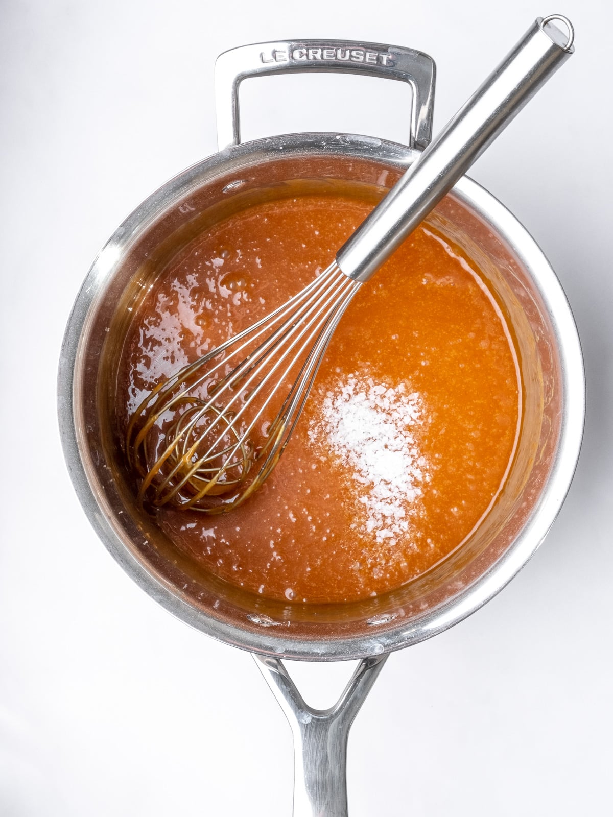 Image shows step 4 of how to make the salted caramel sauce for apple crumble tarts.