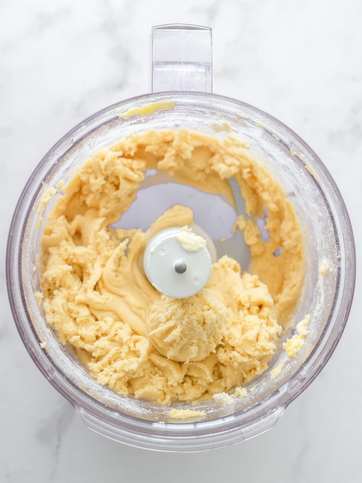 Image shows step 3 of how to make the pastry for apple crumble tarts.
