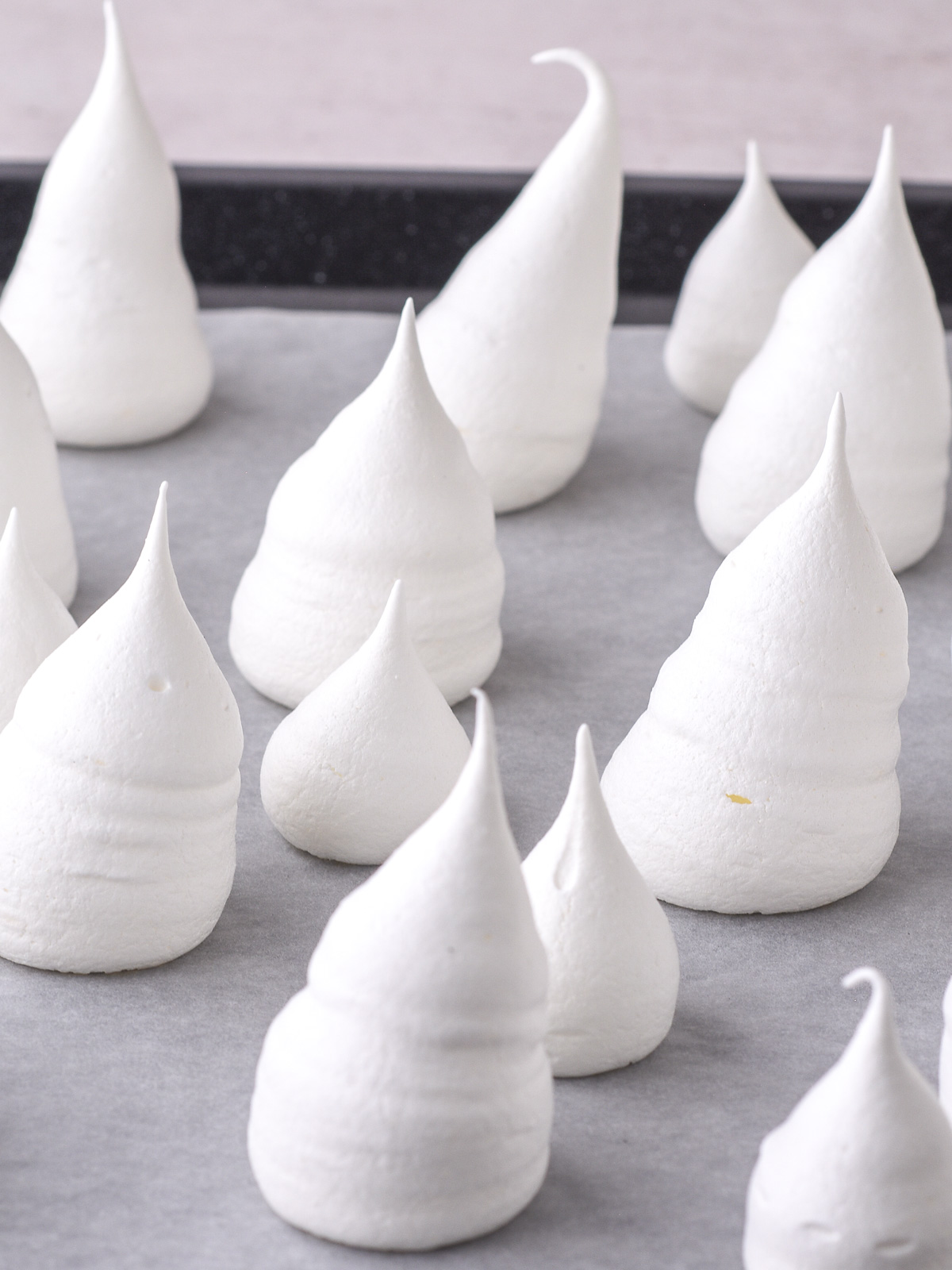 Image shows step 4 of how to make ghost meringues.