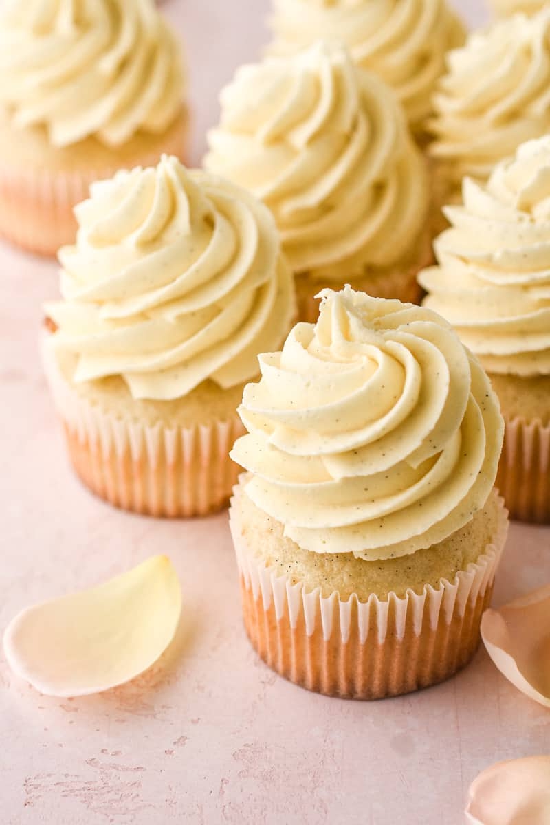 Vanilla Bean Buttercream shown swirled onto vanilla cupcakes. 
