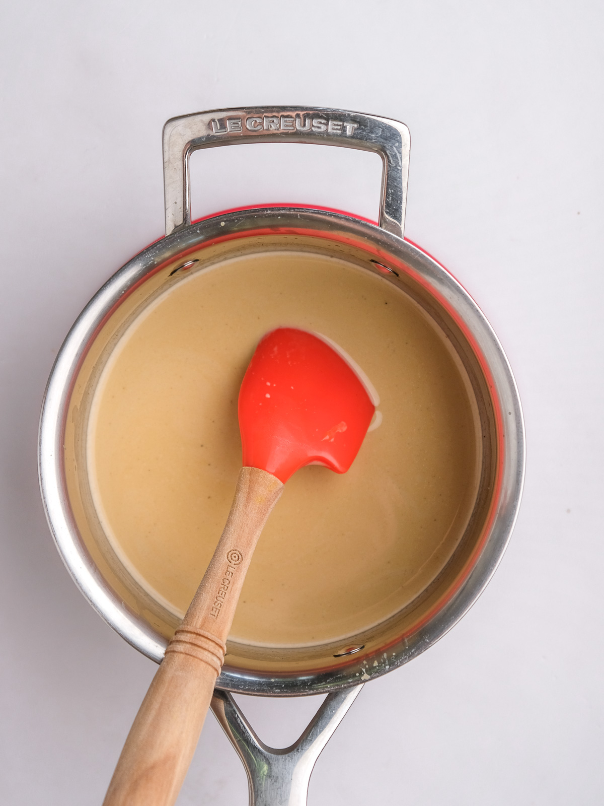 Image shows step 3 of how to make espresso panna cottas.
