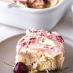 Cherry Cinnamon Roll shown on a grey plate.