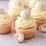 Raffaelo Cupcakes shown decorated on a kitchen counter.