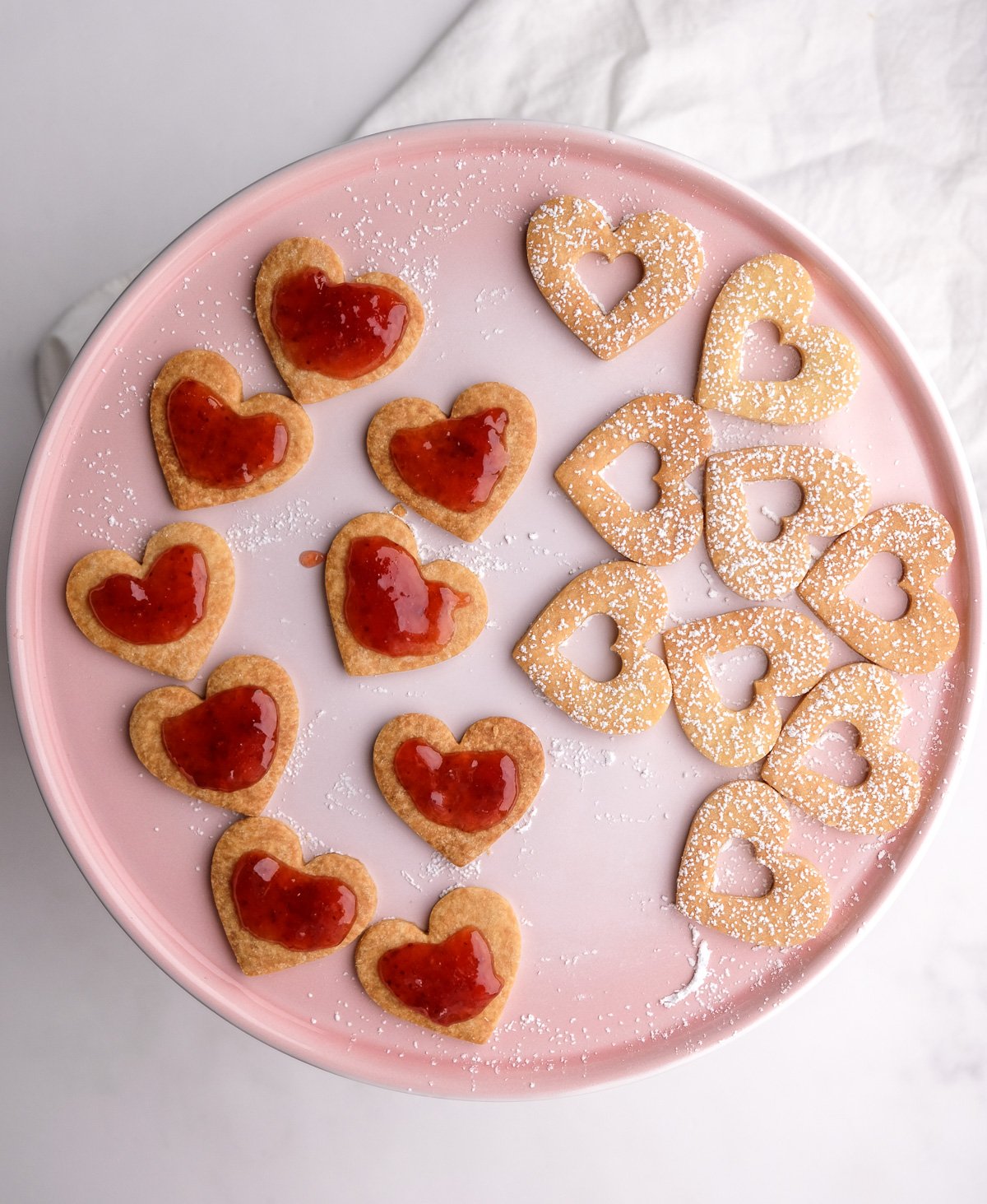 Image shows step 6 of how to make heart cookies with jam.