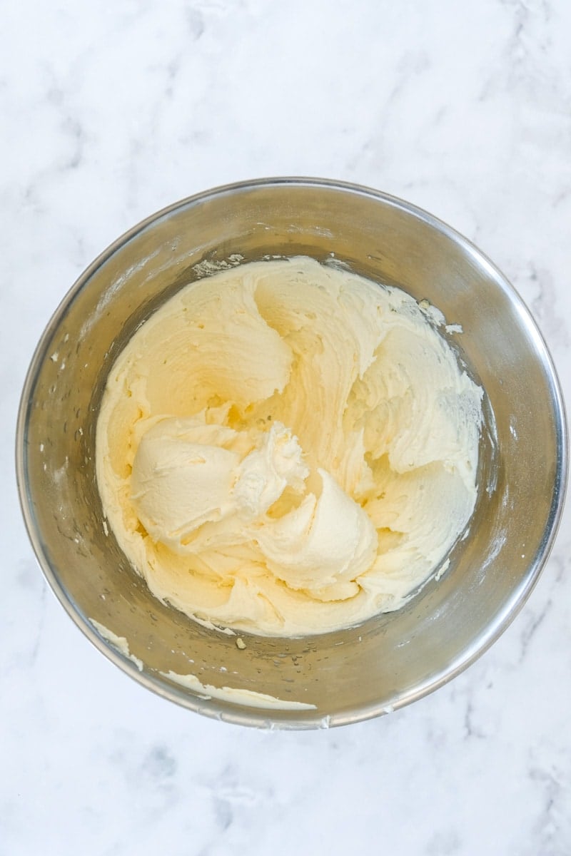 Image shows step 2 of how to make the passionfruit buttercream.