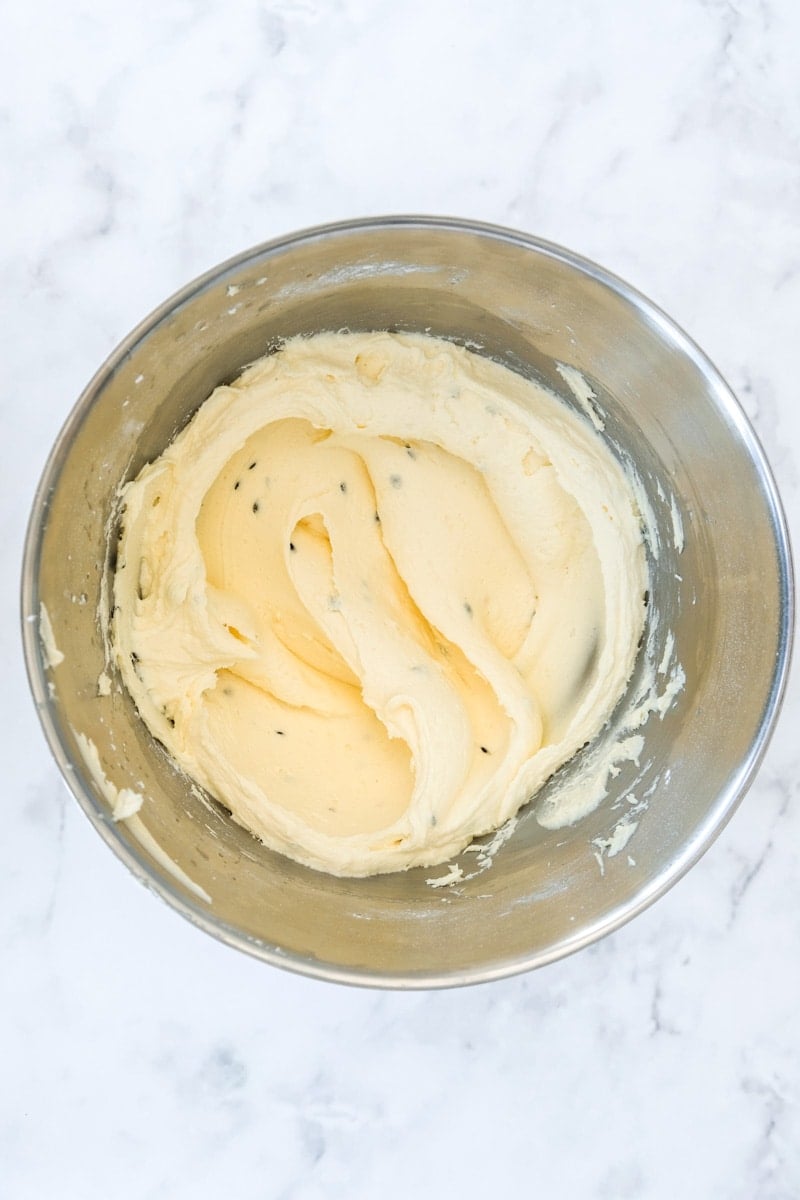 Image shows step 3 of how to make the passionfruit buttercream.