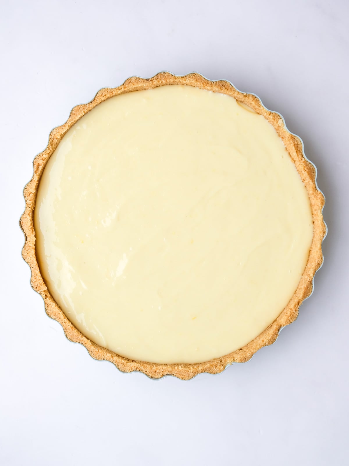 Image shows step 4 of how to make a lemon meringue tart.