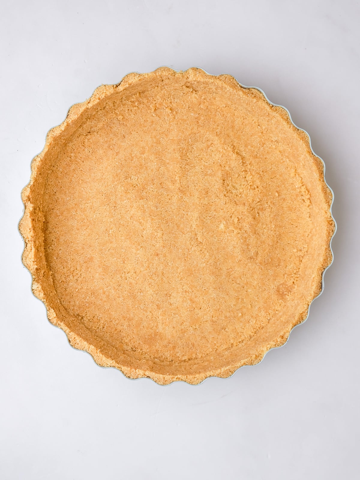 Image shows step 3 of how to make a lemon meringue tart.