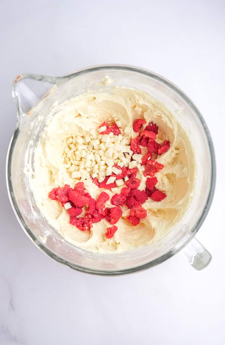 Image showing step 4 of how to make the raspberry white chocolate cupcakes.