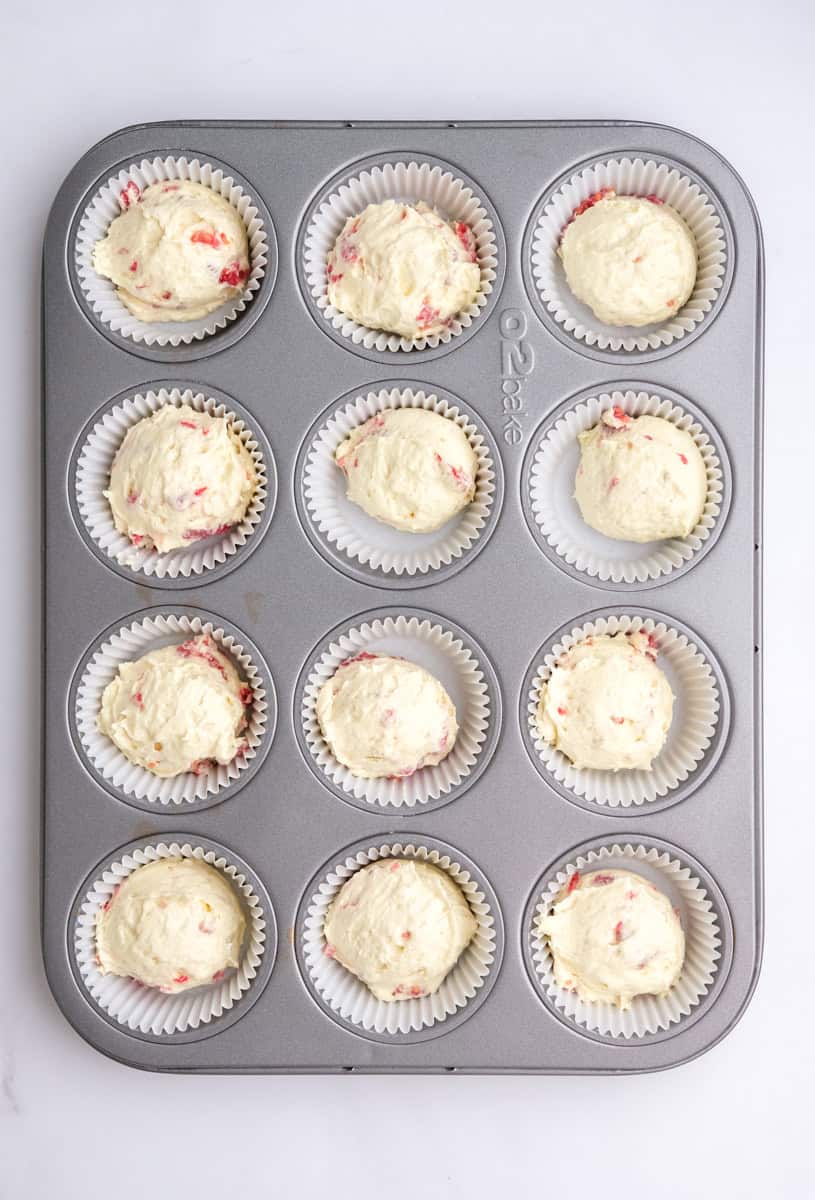 Image showing step 5 of how to make the raspberry white chocolate cupcakes.