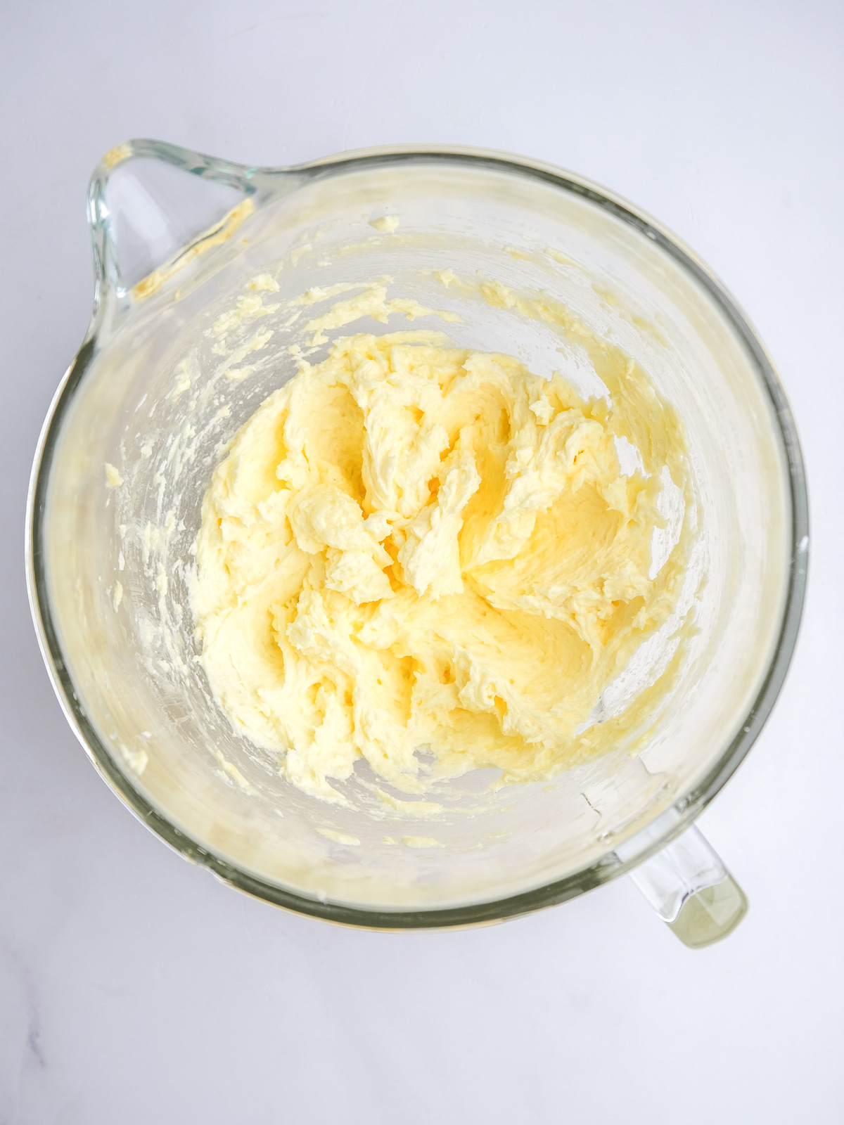 Image shows step 2 of how to make lemon drizzle cupcakes.