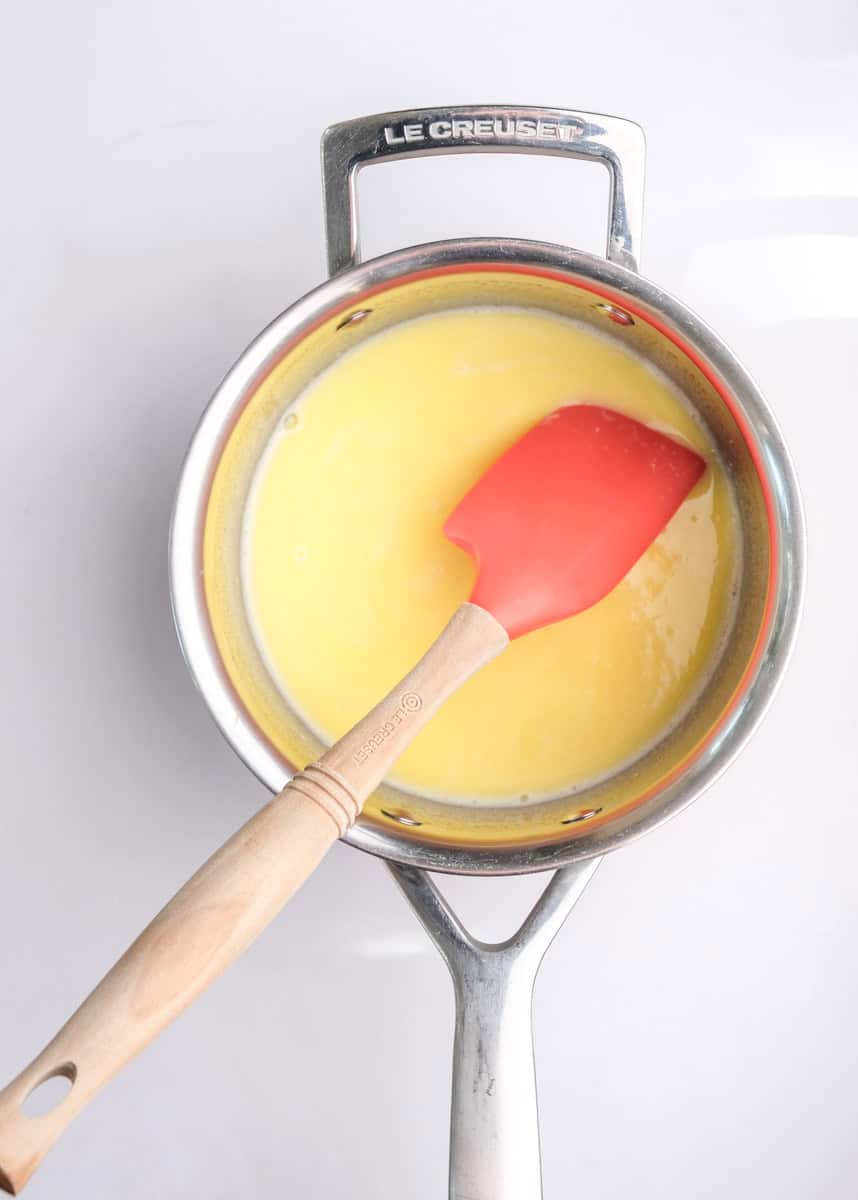 Image shows step 1 of how to make. a hot milk sponge cake.