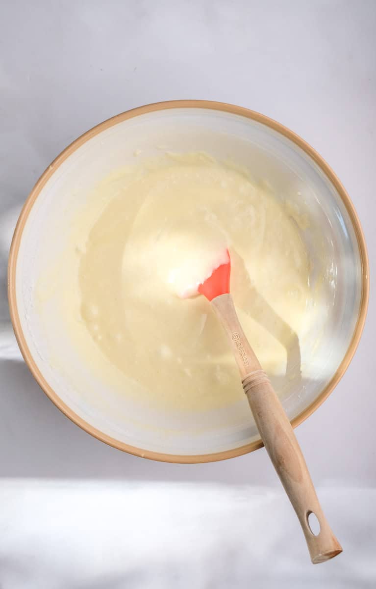 Image shows step 4 of how to make. a hot milk sponge cake.