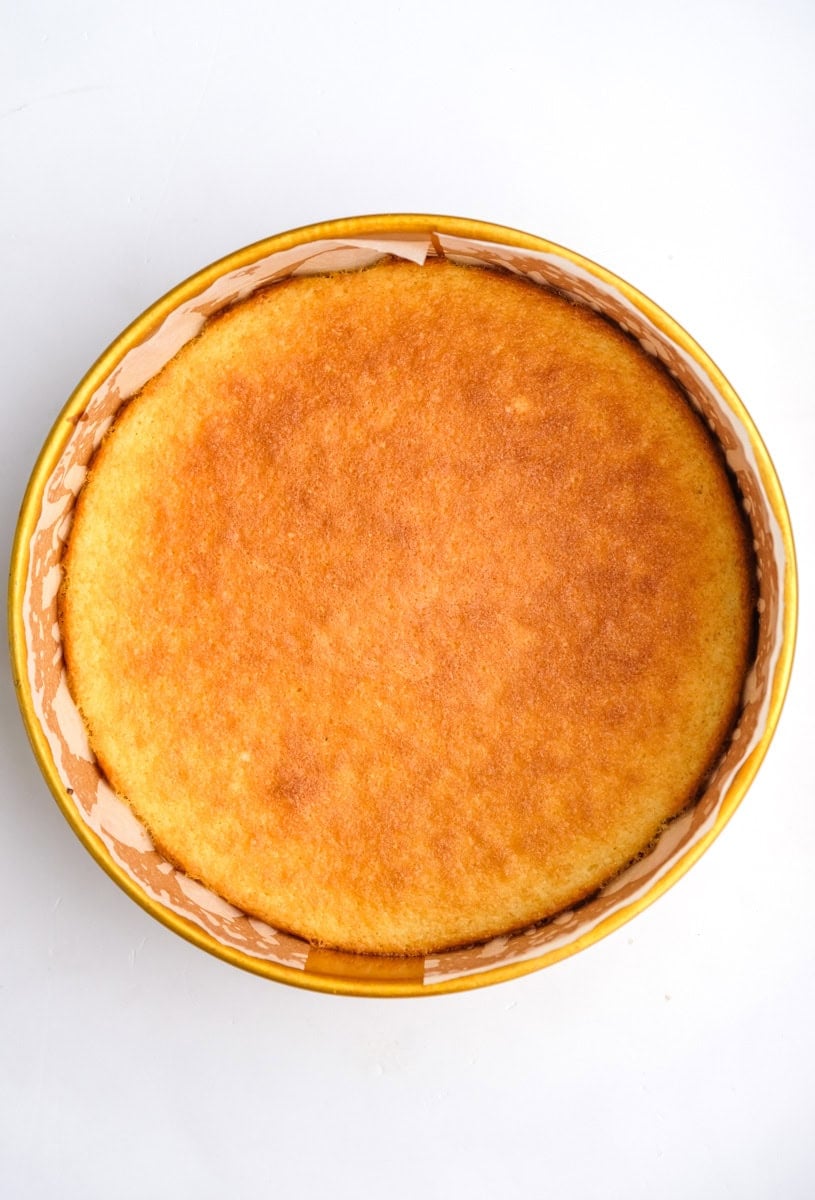 Image shows step 5 of how to make. a hot milk sponge cake.