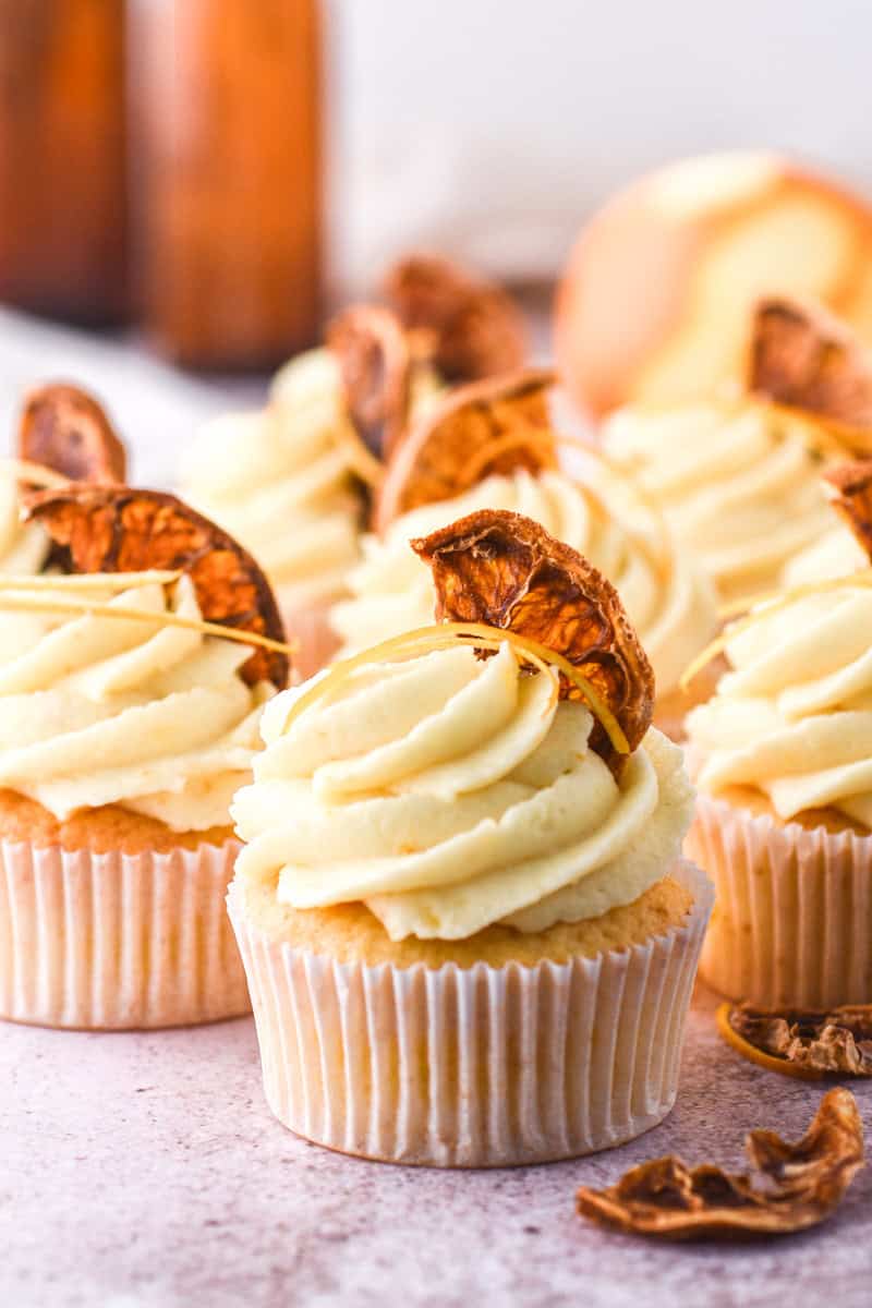 Image shows step 4 of how to make the orange frosting.
