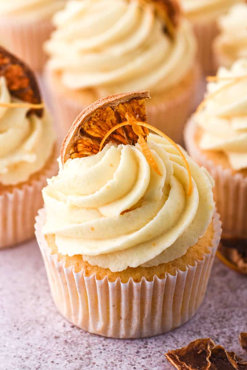 Image showing one cupcake in focus you can see the swirl of frosting nicely. 