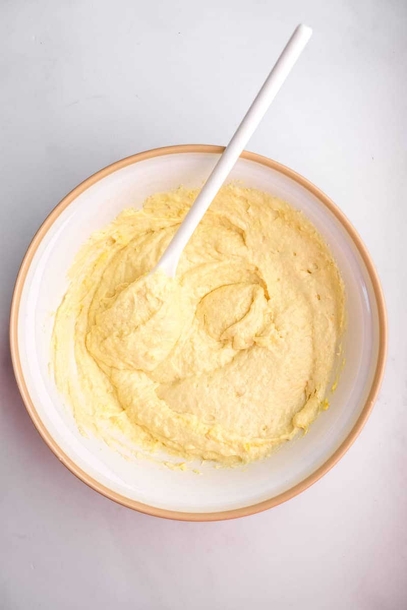 Image shows step 4 of how to make the orange cupcakes.