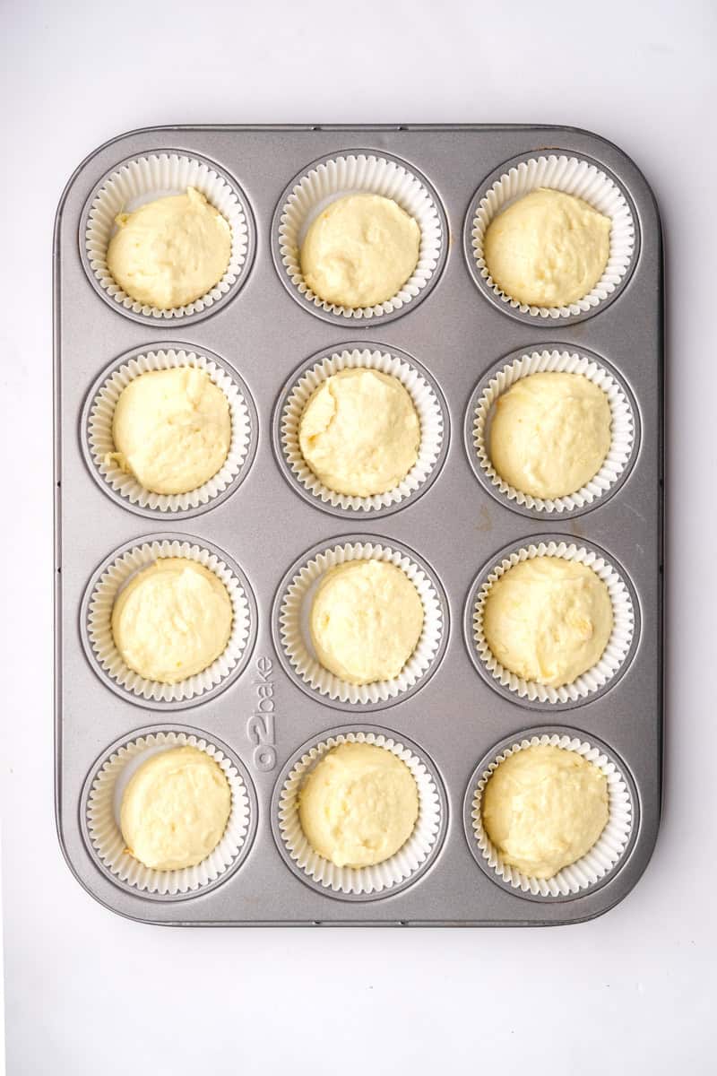 Image shows step 5 of how to make the orange cupcakes.