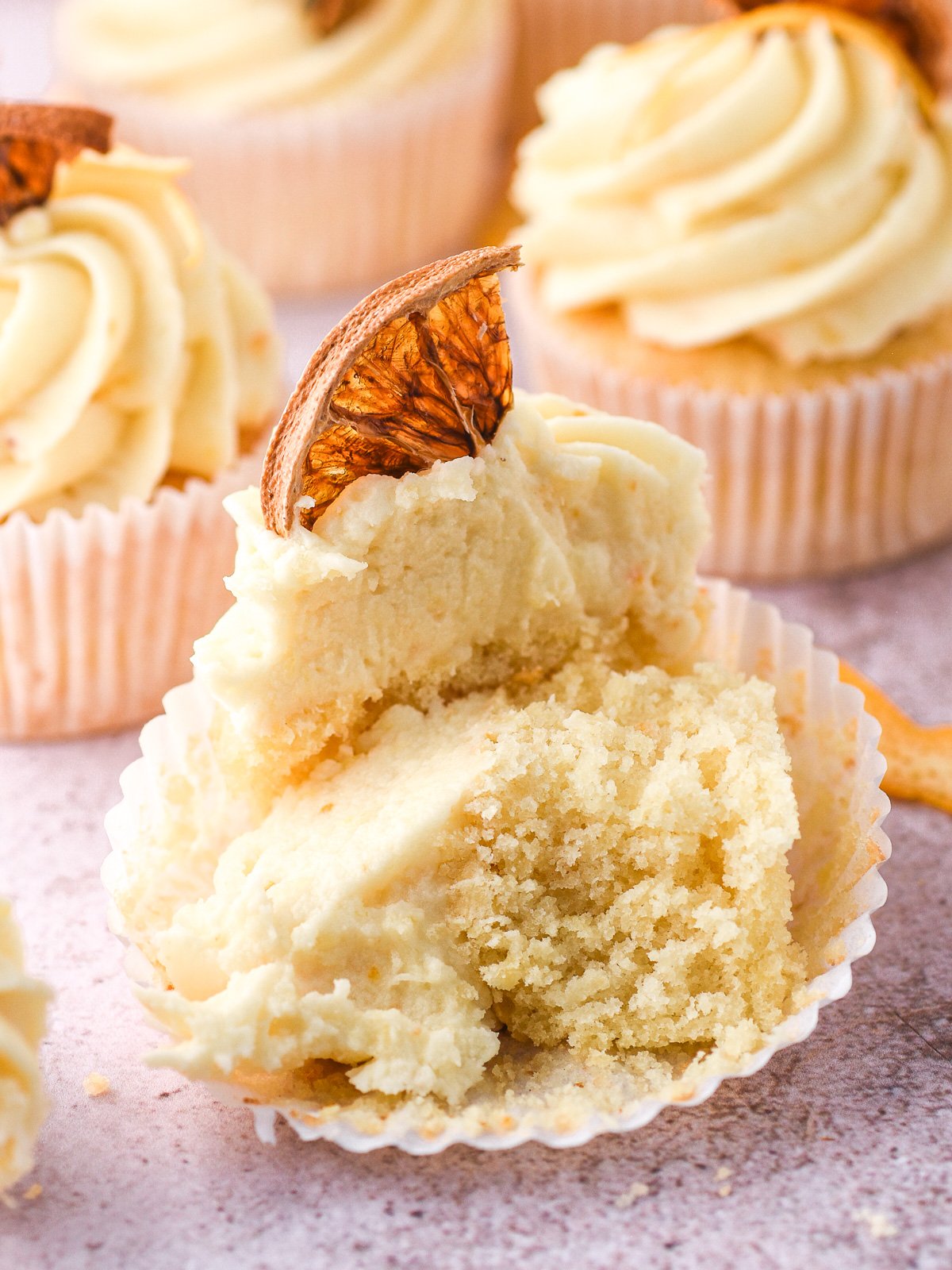 Image shows a cupcake sliced in half so that you can see the fluffy texture of the cupcake.