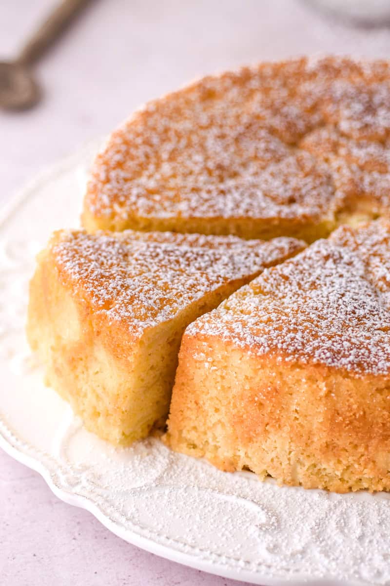 Up close image of the whole cake, a slice is cut but has not been removed.