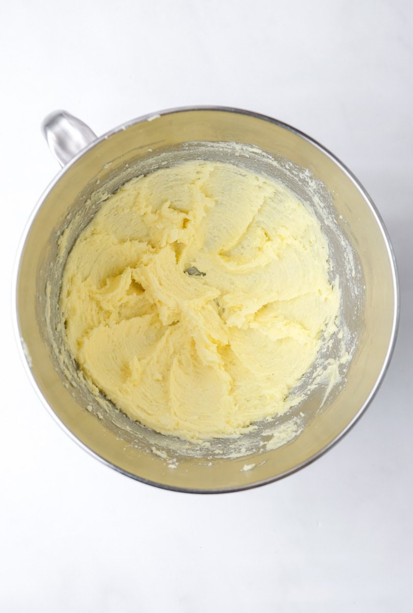 Image shows step 2 of how to make a mixed berry cake.