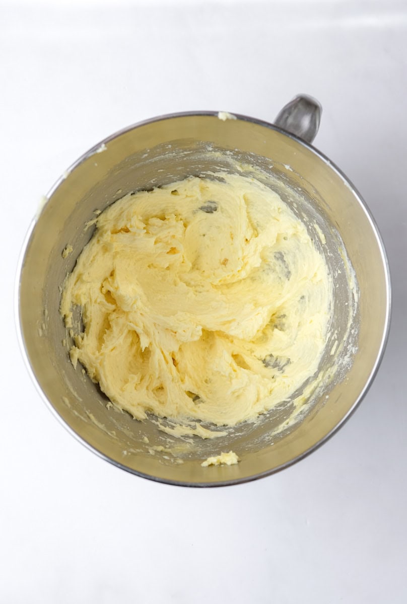 Image shows step 3 of how to make a mixed berry cake.