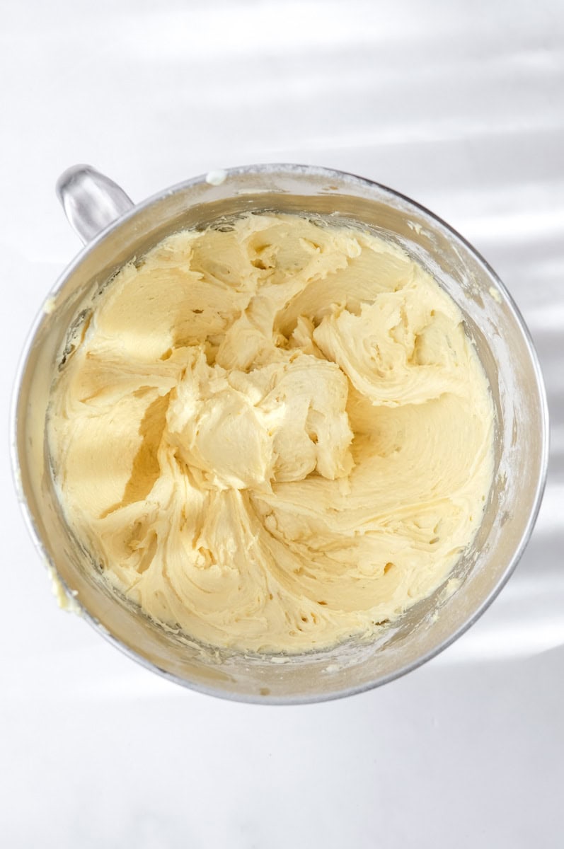 Image shows step 4 of how to make a mixed berry cake.