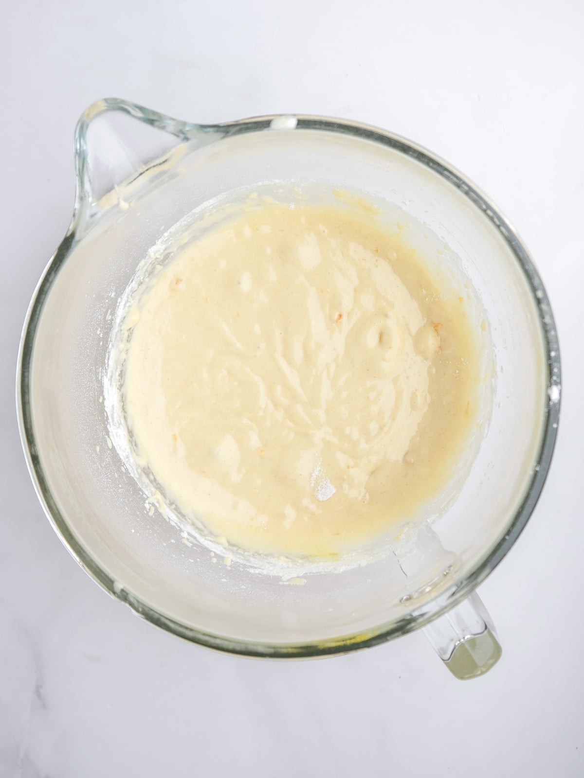 Image shows step 2 of how to make the malva pudding layer of this desert.