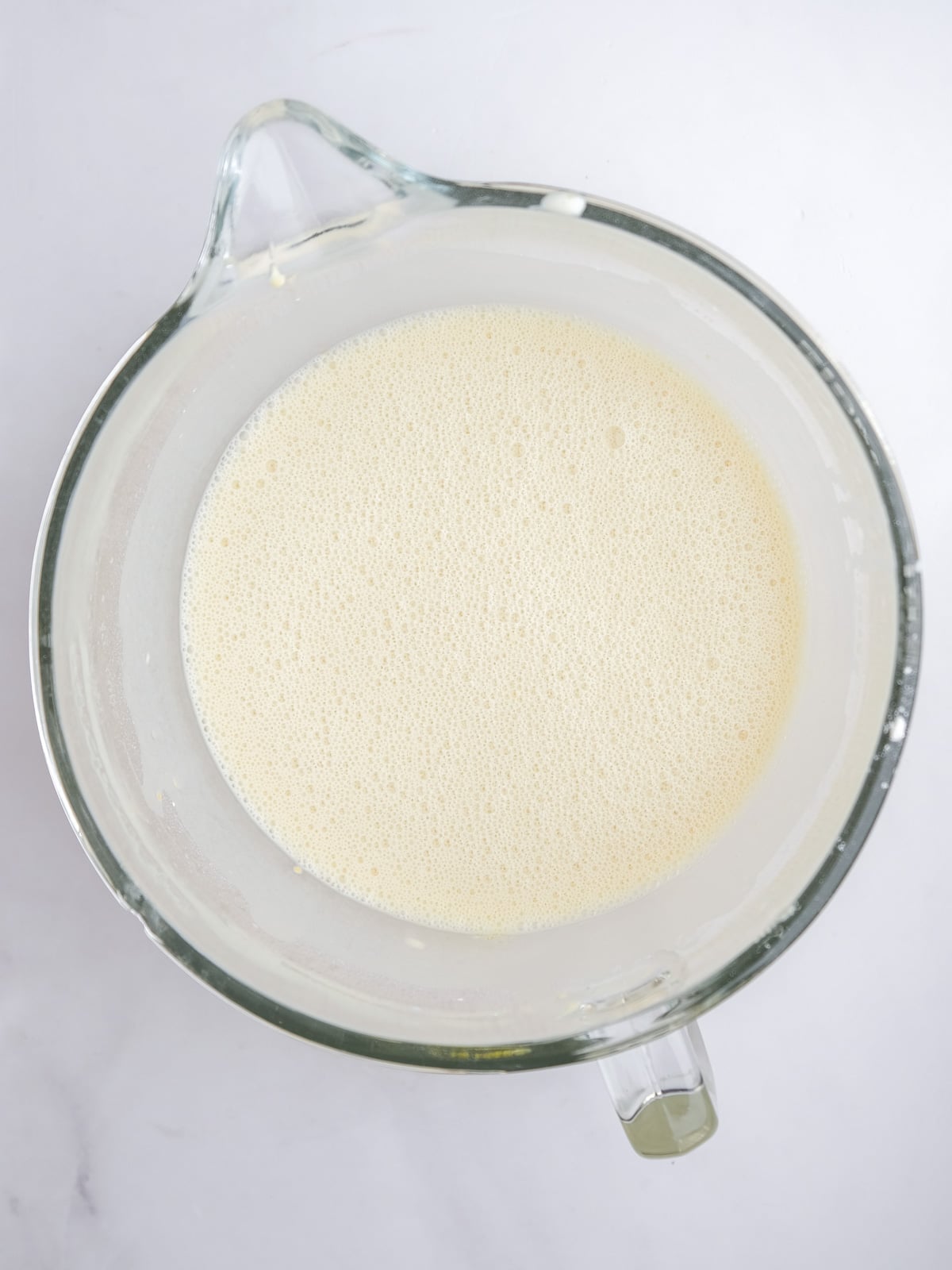 Image shows step 3 of how to make the malva pudding layer of this desert.