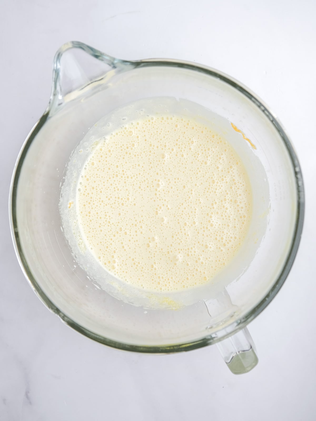 Image shows step 1 of how to make the malva pudding layer of this desert.