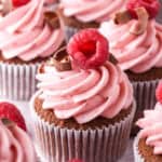 Raspberry Chocolate Cupcakes shown on a kitchen counter.
