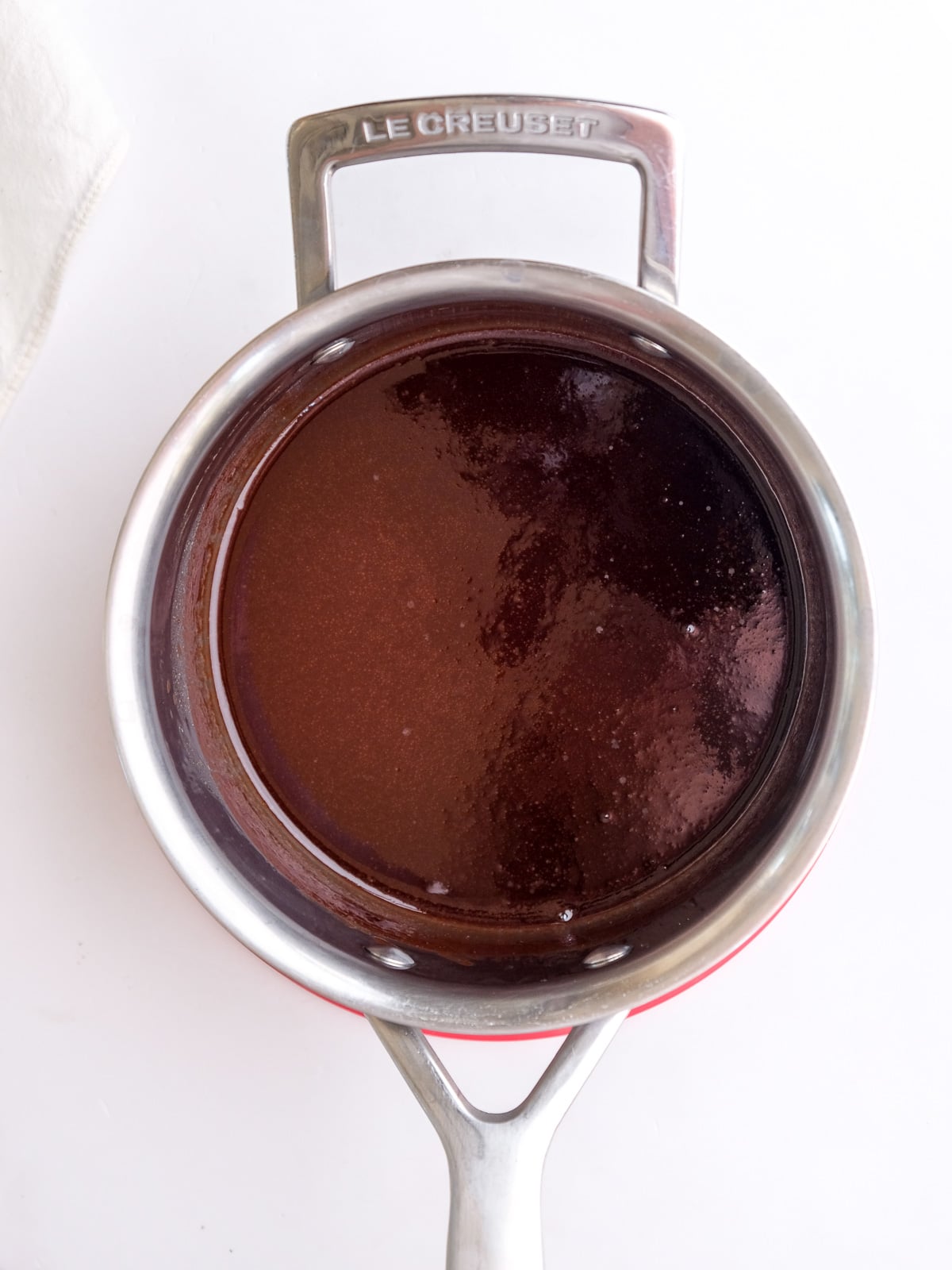Image shows step 1 of how to make hot fudge chocolate sauce.