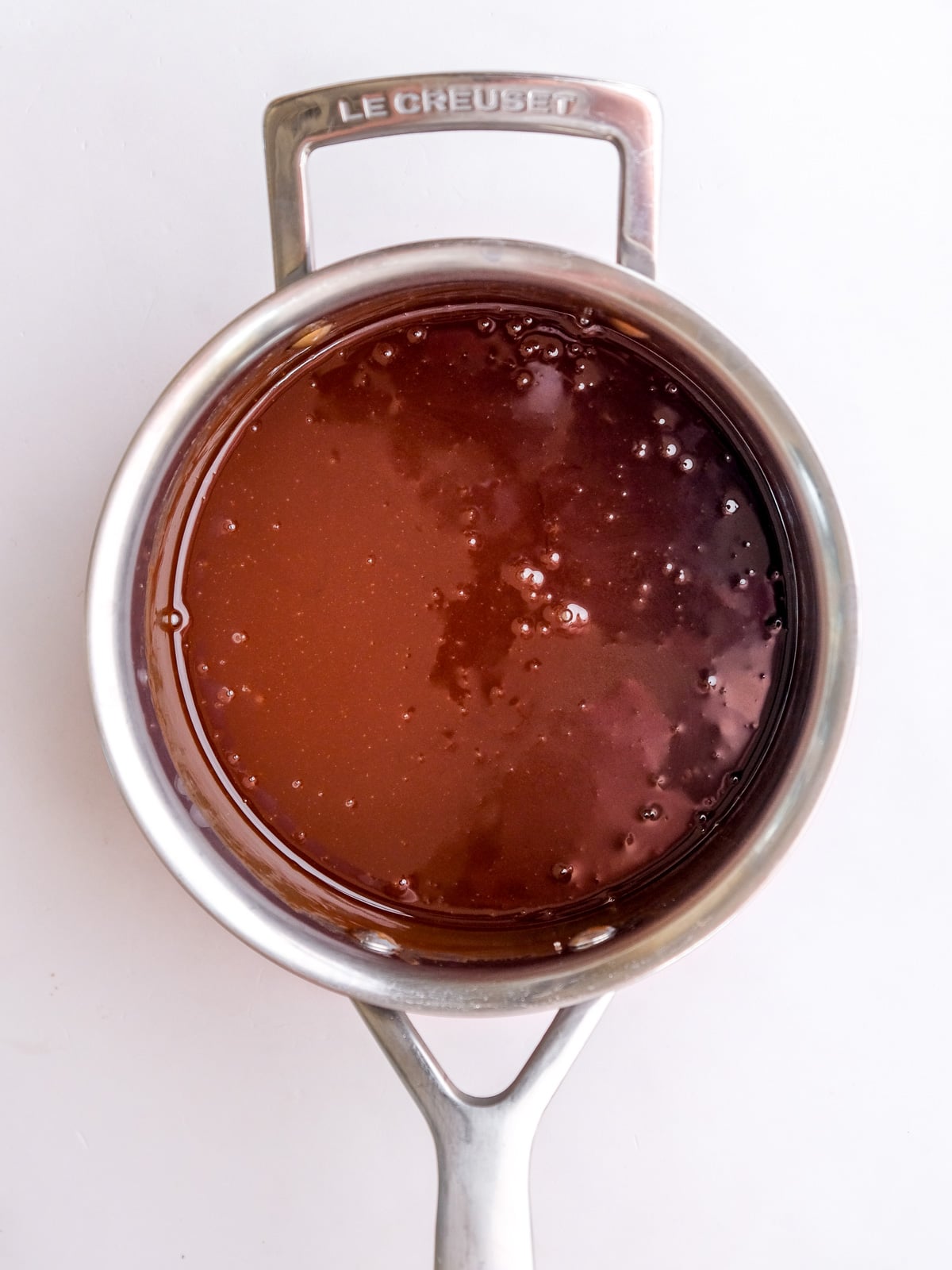 Image shows step 2 of how to make hot fudge chocolate sauce.
