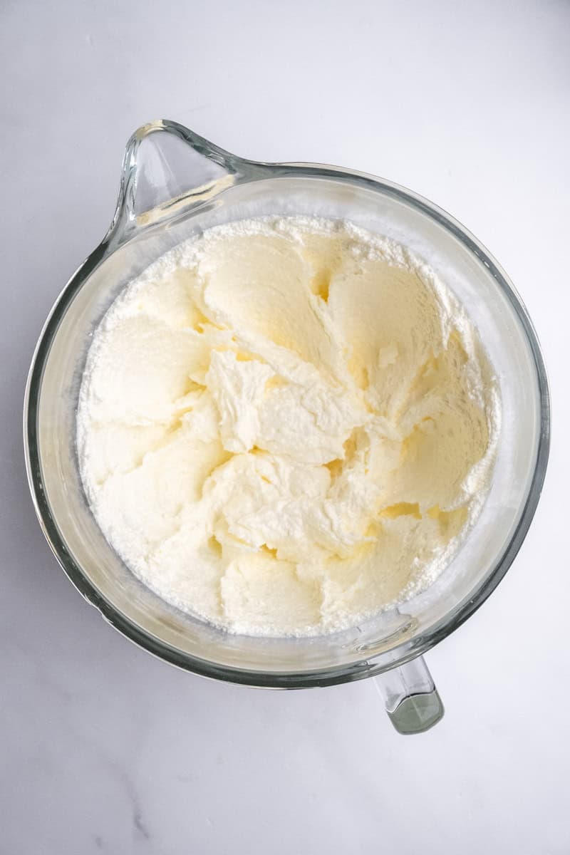 Image shows step one of how to make the vanilla cake.