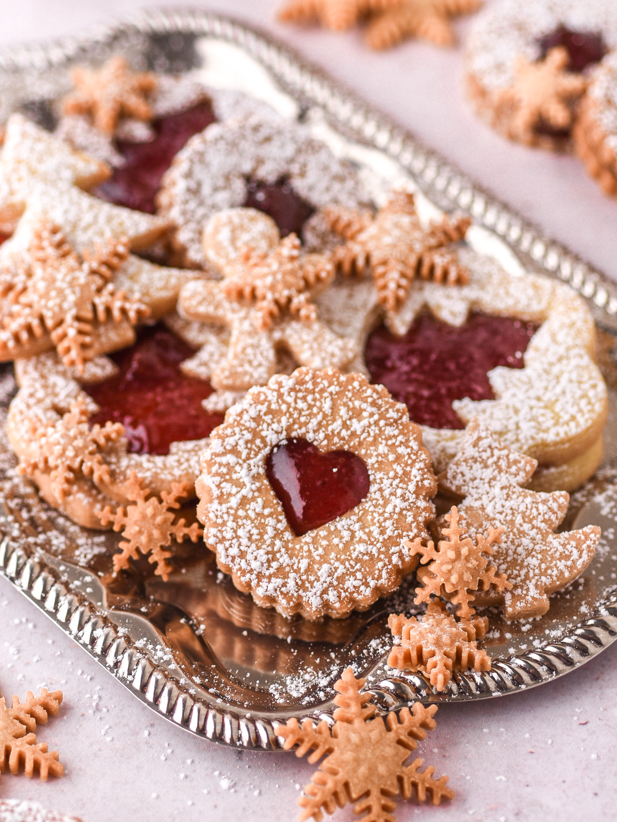Christmas Butter Cookies of different shapes shown on a silver tray.