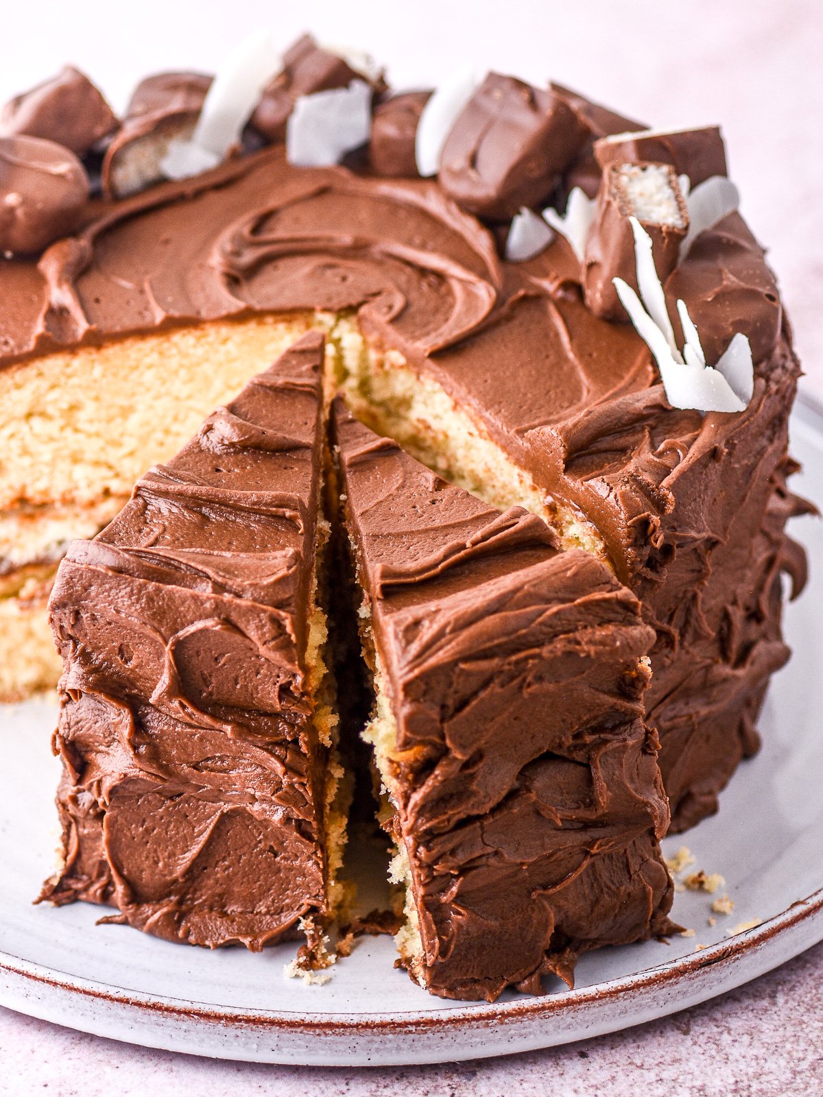 Image showing the whole cake with a few slices cut.