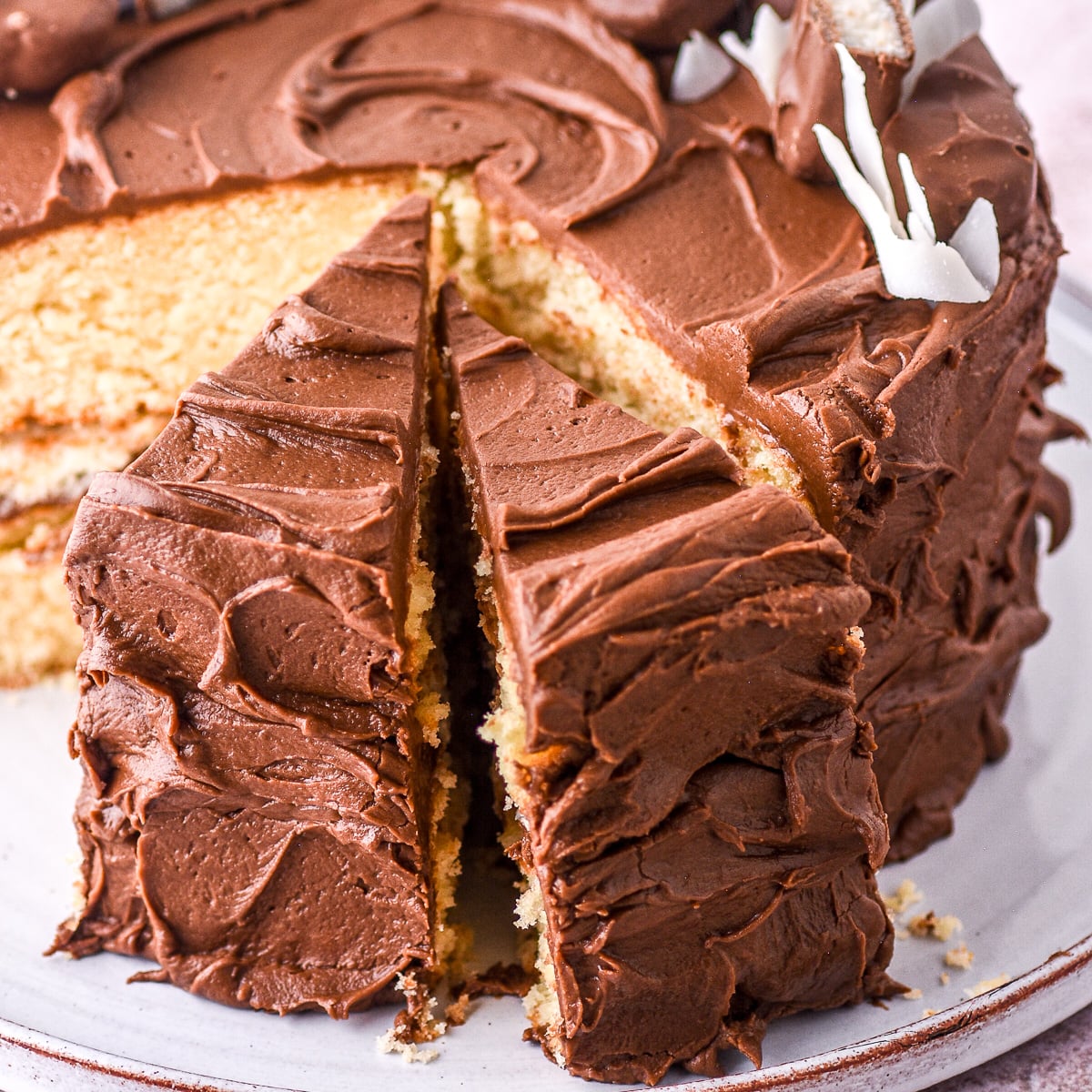 Bounty Cake shown shown with a few slices cut.